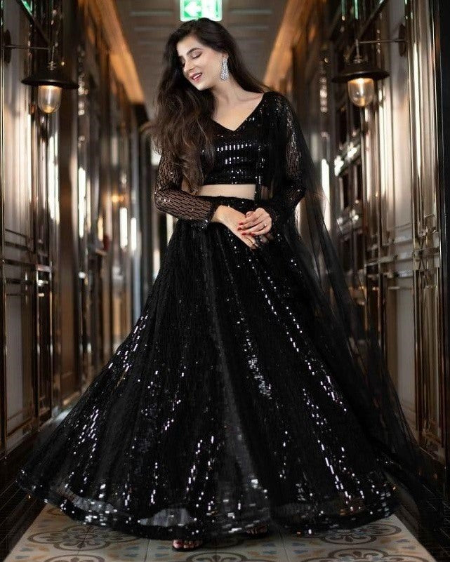 Black net heavy sequence worked ceremonial lehenga choli