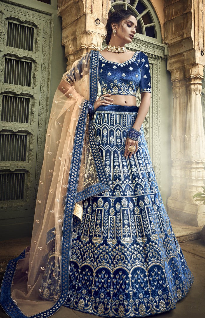 Blue velvet thread embroidered and zari work bridal lehenga choli