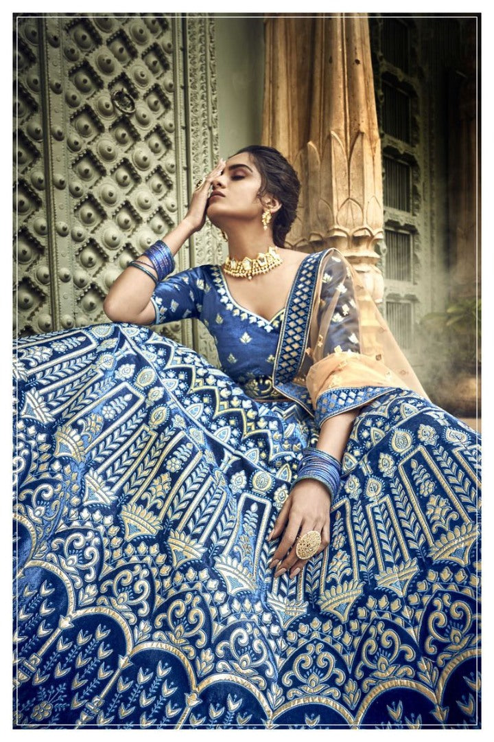 Blue velvet thread embroidered and zari work bridal lehenga choli