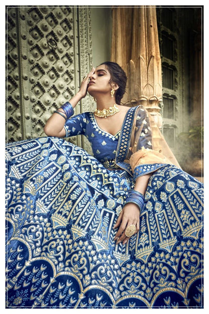 Blue velvet thread embroidered and zari work bridal lehenga choli