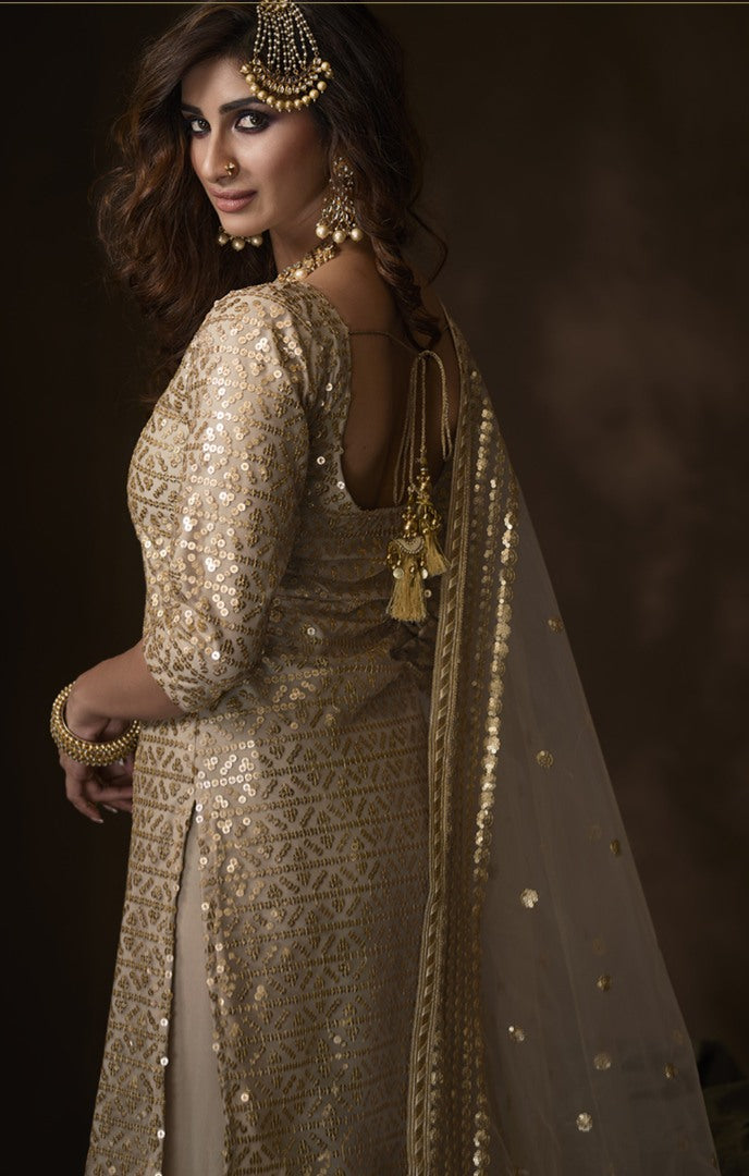 Dusty beige soft net sequence work ceremonial sharara salwar suit