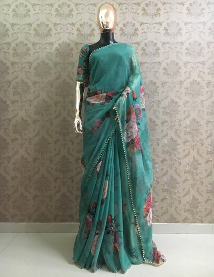 Green floral printed pearl border saree