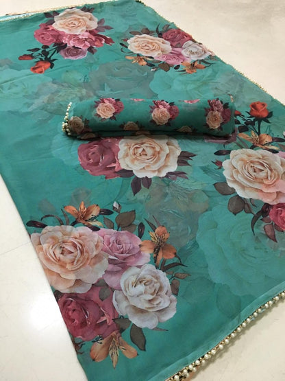 Green floral printed pearl border saree