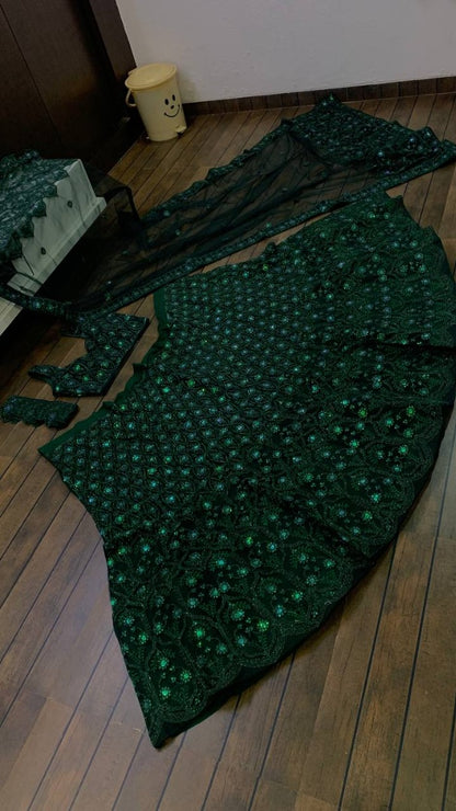 Green net heavy embroidery worked lehenga for wedding