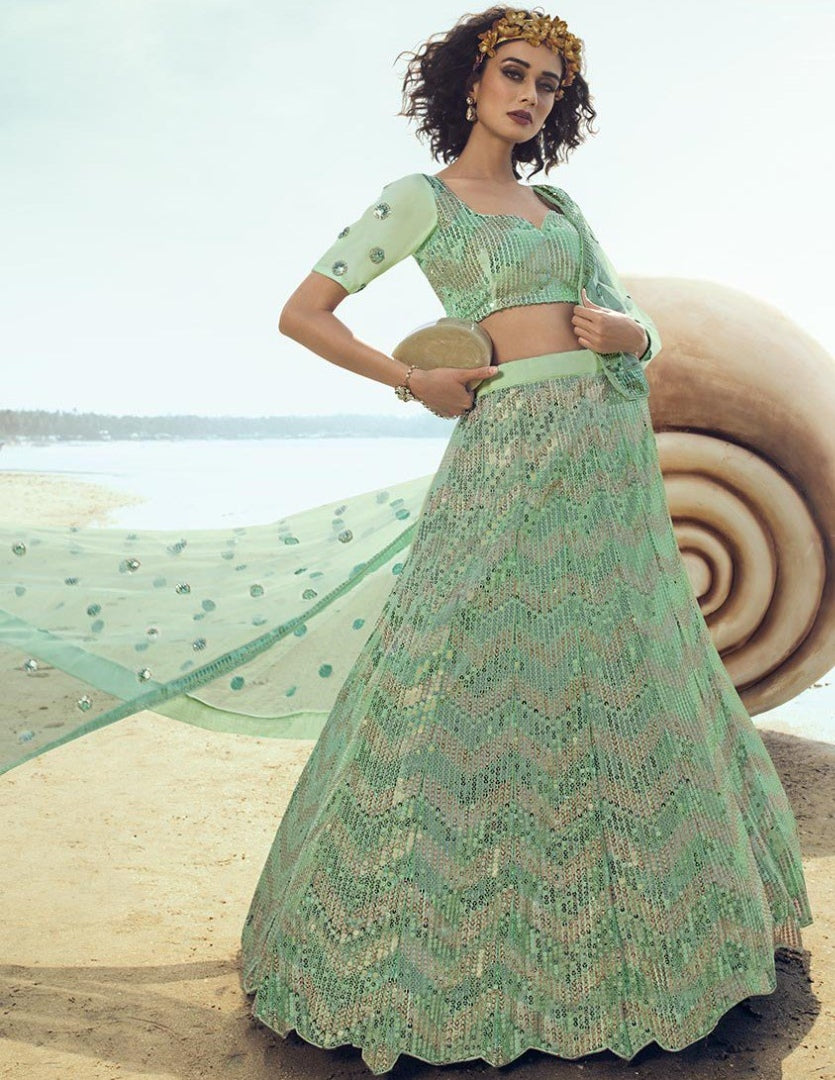 Green soft net sequence work ceremonial lehenga choli