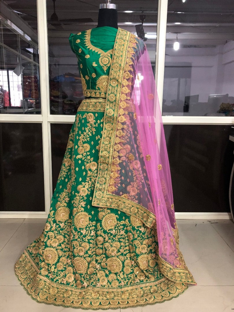 Green tapeta silk heavy embroidered bridal lehenga