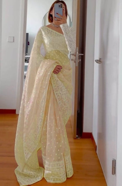 Light yellow organza silk heavy thread embroidery work saree for ceremony