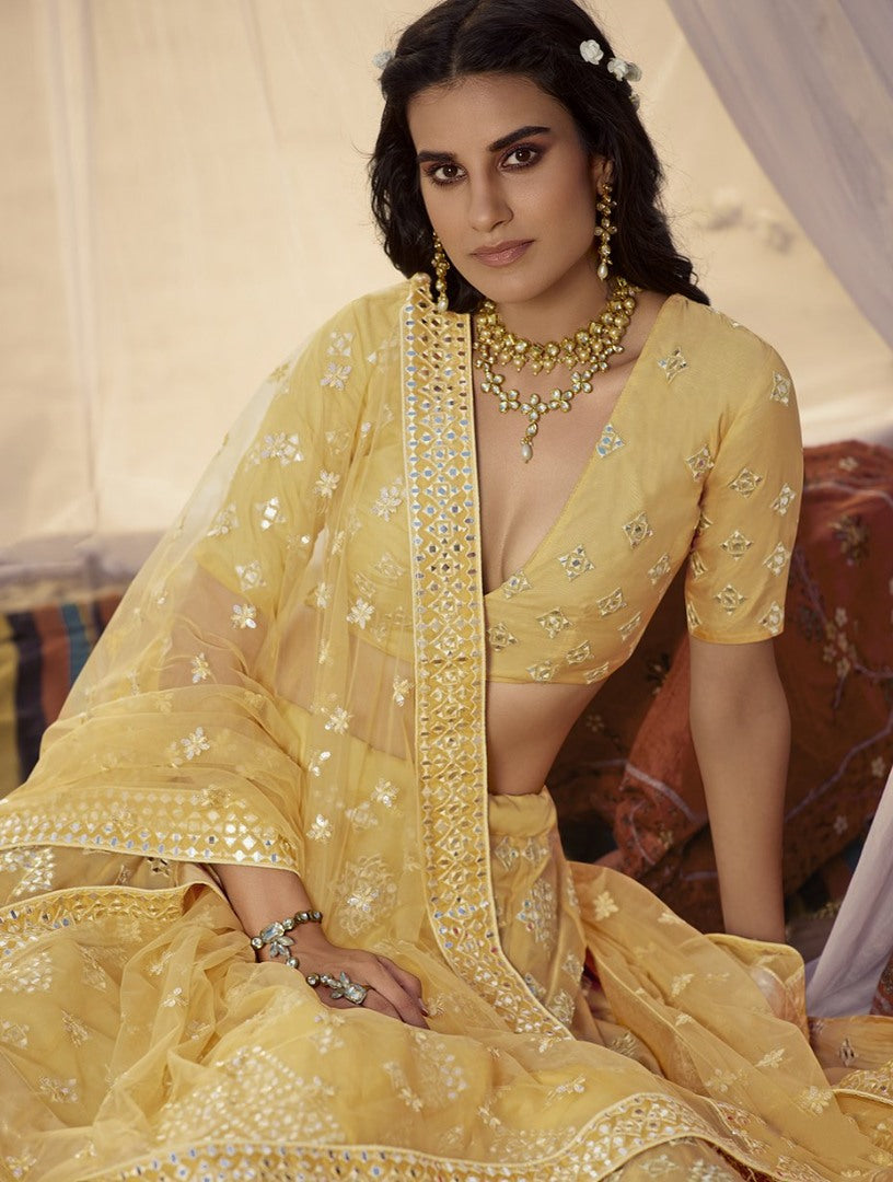 Mustard yellow organza thread, foil & mirror work bridal lehenga choli