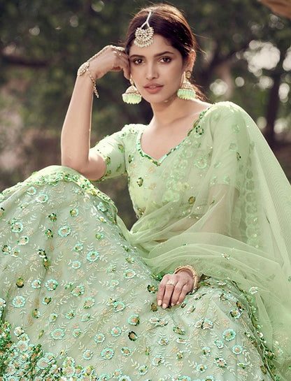 Pista green soft net sequence work bridal lehenga choli