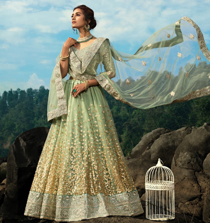 Pista green soft net sequence work bridal lehenga choli