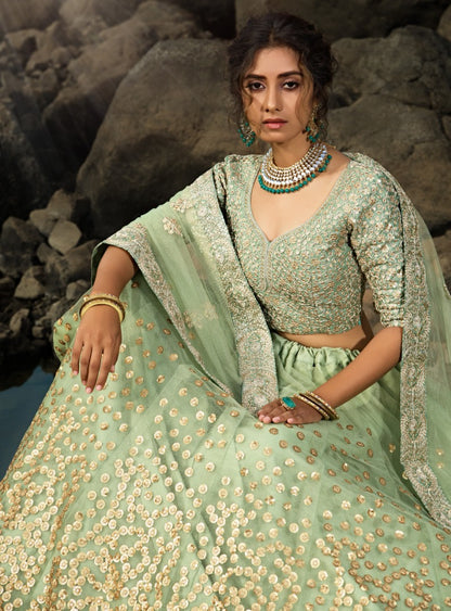 Pista green soft net sequence work bridal lehenga choli