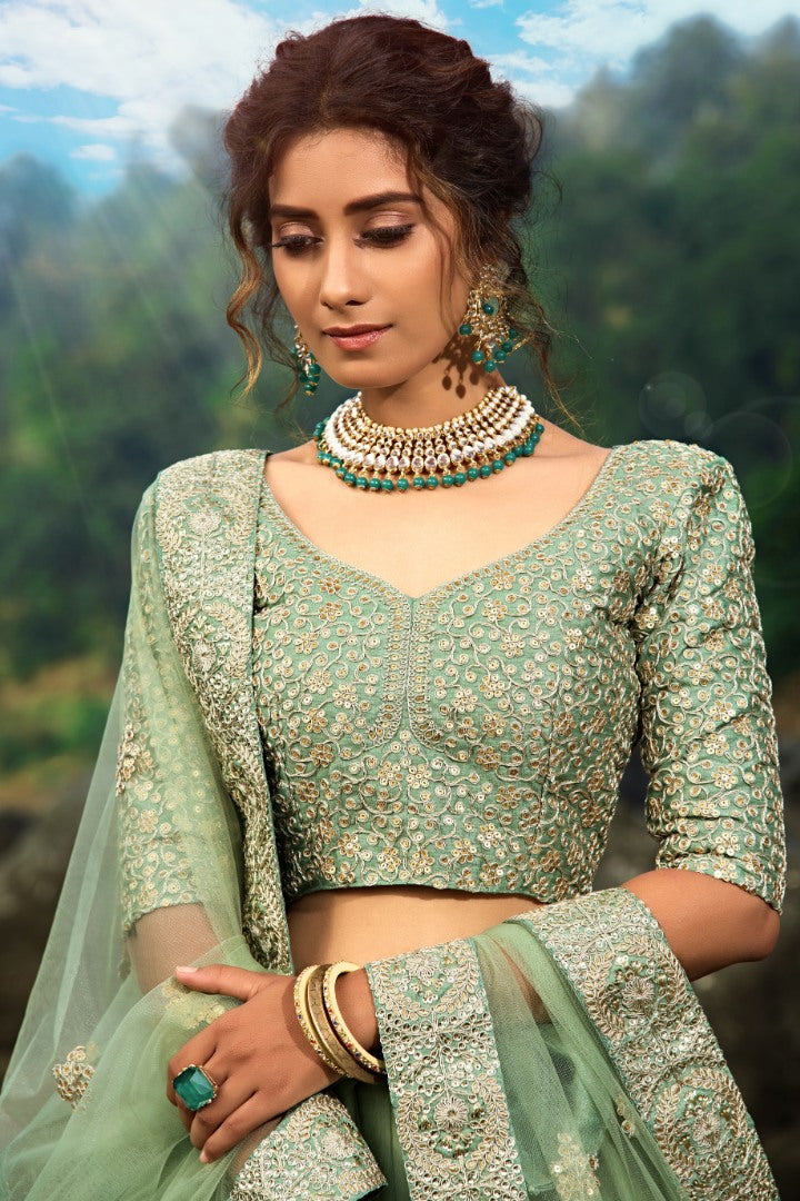 Pista green soft net sequence work bridal lehenga choli