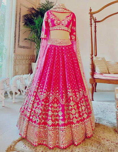 Rani pink phantom silk heavy embroidered wedding lehenga choli