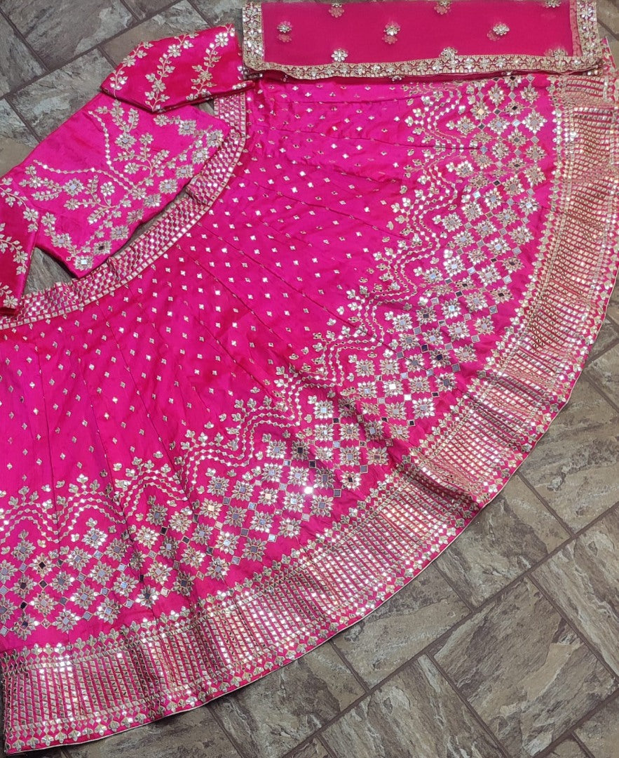 Rani pink phantom silk heavy embroidered wedding lehenga choli