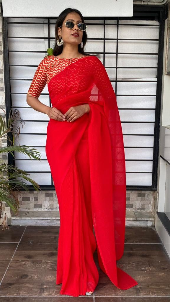 Red georgette pleated partywear saree with heavy sequence work blouse