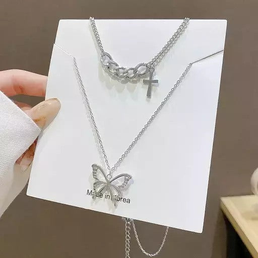 Silver steel butterfly and cross multi layered necklace