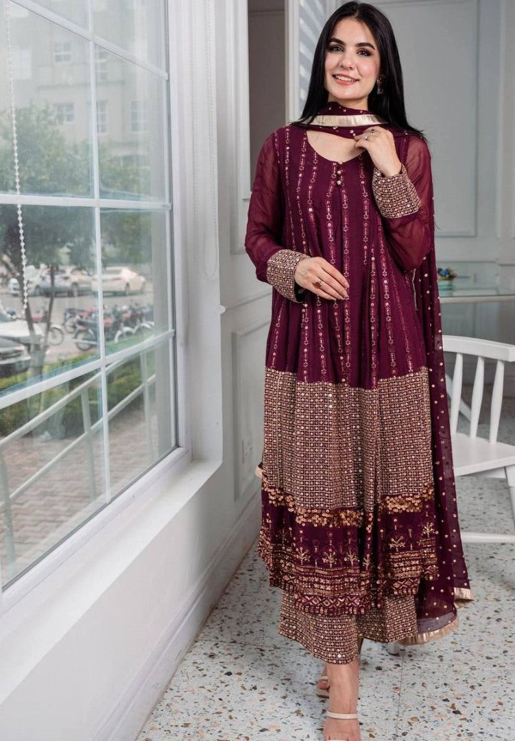 Wine heavy embroidery worked salwar suit with shrug