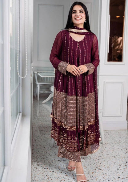 Wine heavy embroidery worked salwar suit with shrug