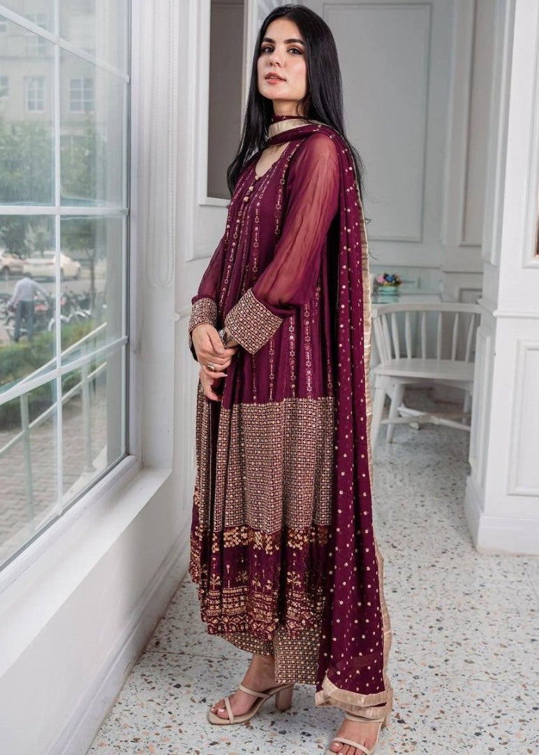 Wine heavy embroidery worked salwar suit with shrug