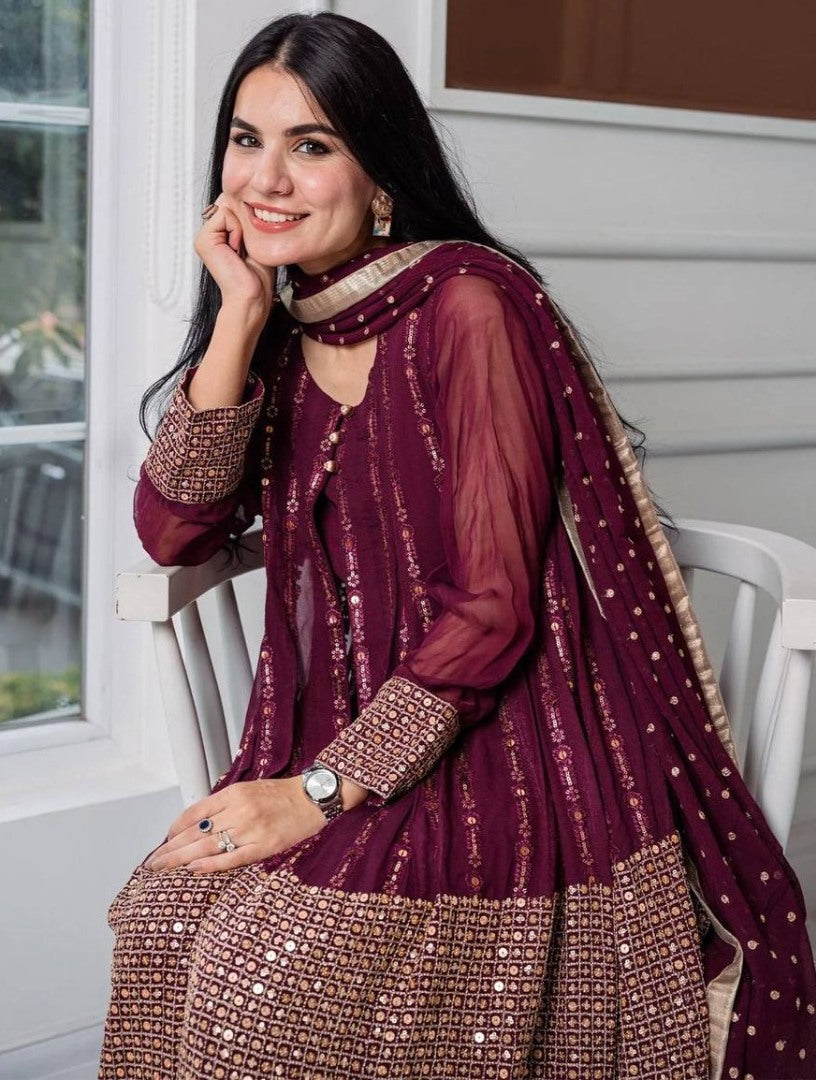 Wine heavy embroidery worked salwar suit with shrug