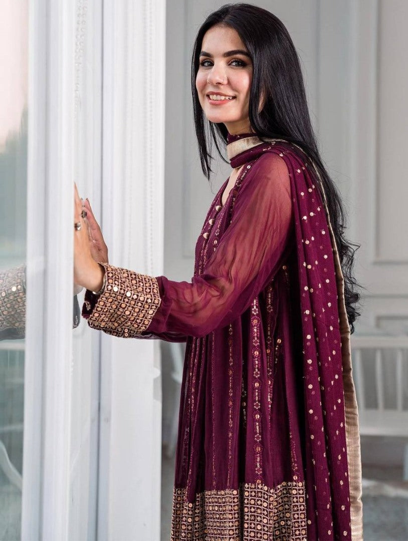 Wine heavy embroidery worked salwar suit with shrug