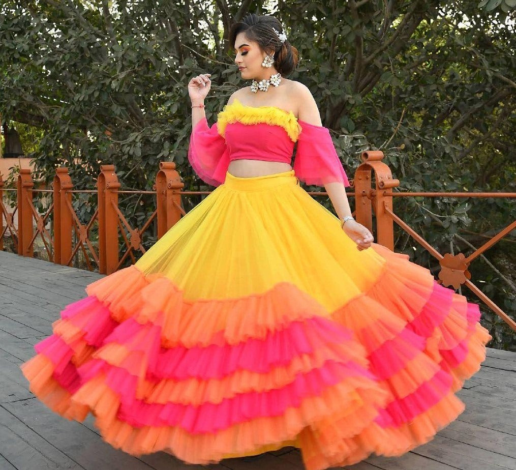 Yellow butterfly net umbrella flair with ruffle work lehenga choli