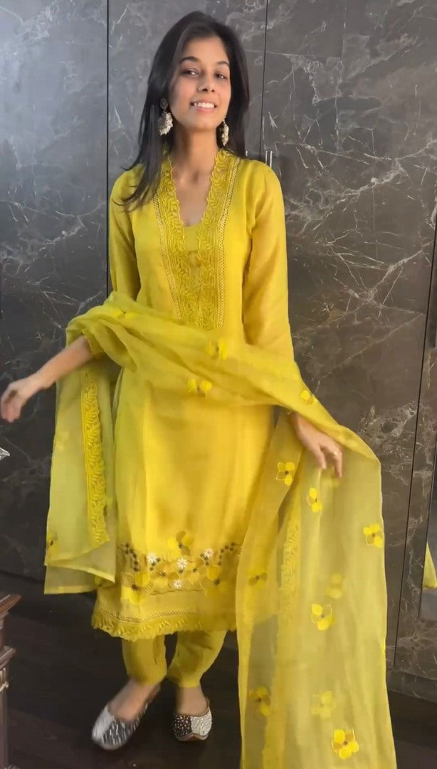 Yellow ceremonial salwar suit with organza dupatta