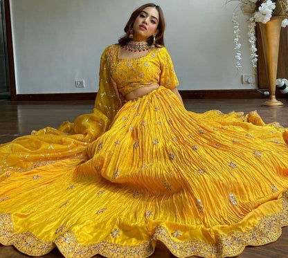 Yellow chinon silk embroidered pleated lehenga for haldi ceremony