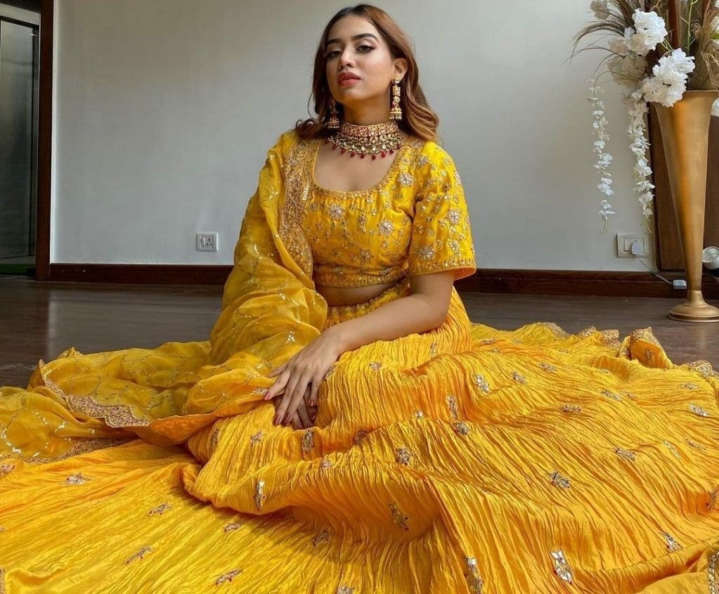 Yellow chinon silk embroidered pleated lehenga for haldi ceremony