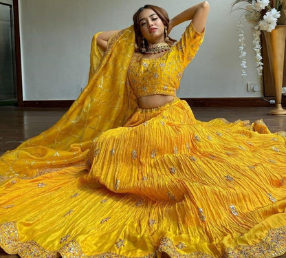 Yellow chinon silk embroidered pleated lehenga for haldi ceremony