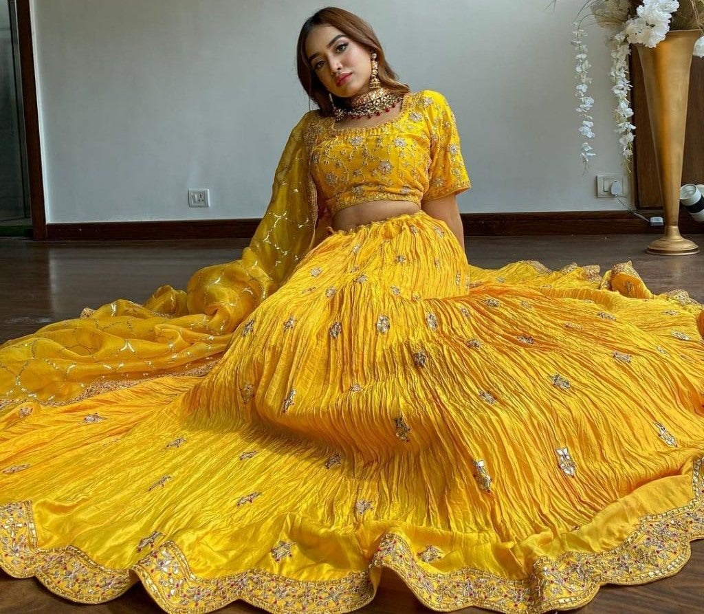 Yellow chinon silk embroidered pleated lehenga for haldi ceremony