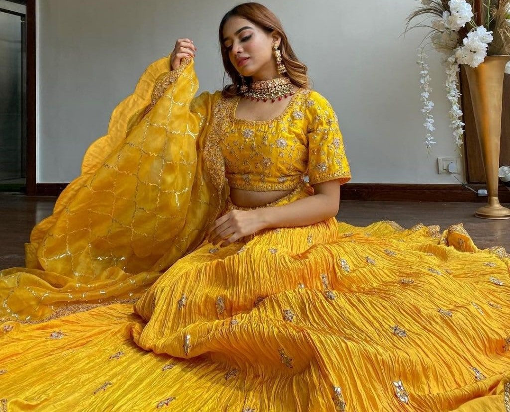 Yellow chinon silk embroidered pleated lehenga for haldi ceremony