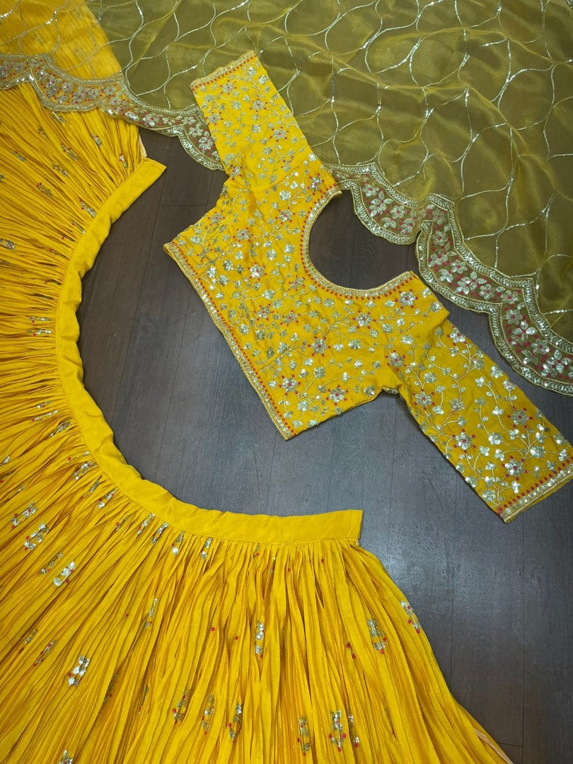 Yellow chinon silk embroidered pleated lehenga for haldi ceremony