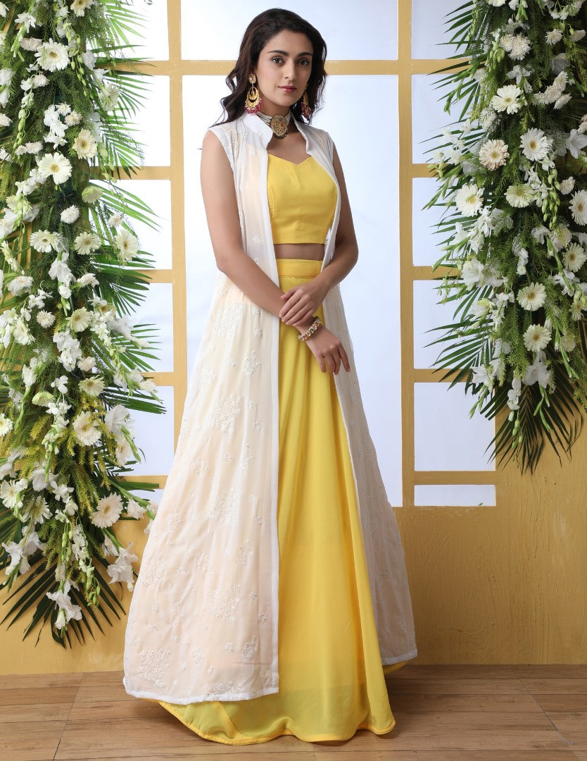 Yellow georgette lehenga with white thread work koti