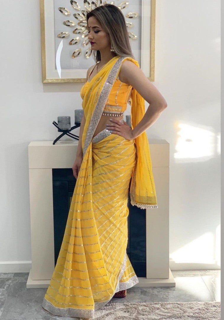Yellow georgette paper embroidered festival wear saree