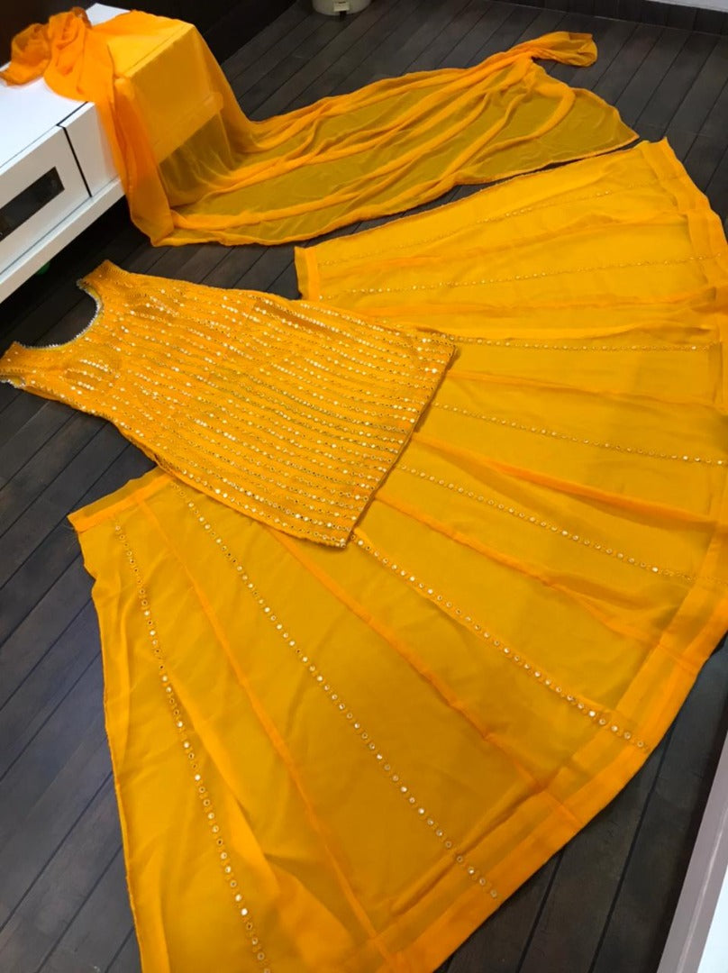 Yellow georgette paper mirror work lehenga suit