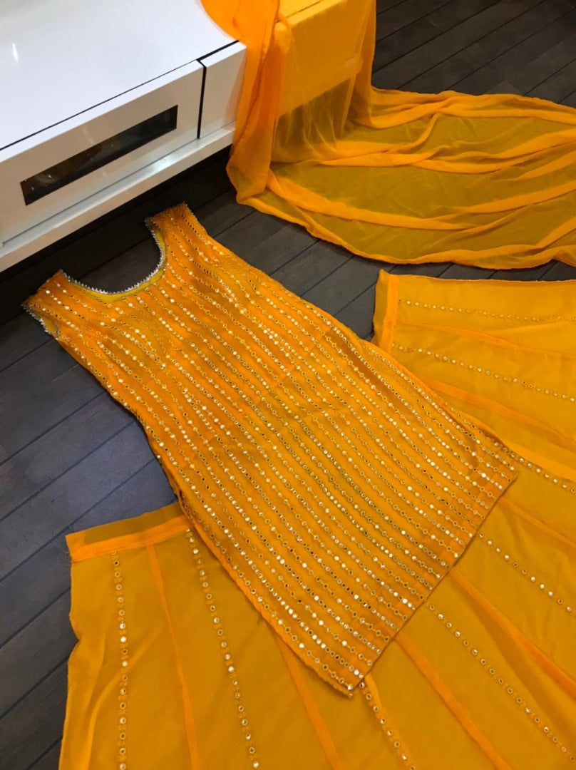 Yellow georgette paper mirror work lehenga suit