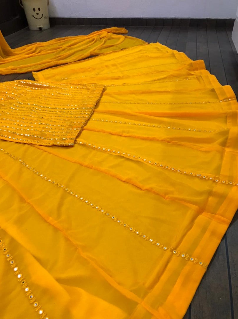 Yellow georgette paper mirror work lehenga suit