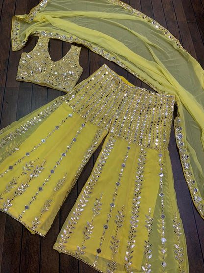 Yellow georgette paper mirror work sharara suit