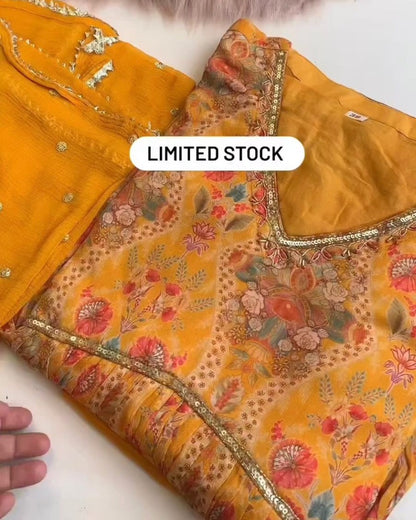 Yellow georgette print and hand worked alia cut kurti