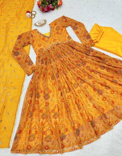 Yellow georgette print and hand worked alia cut kurti