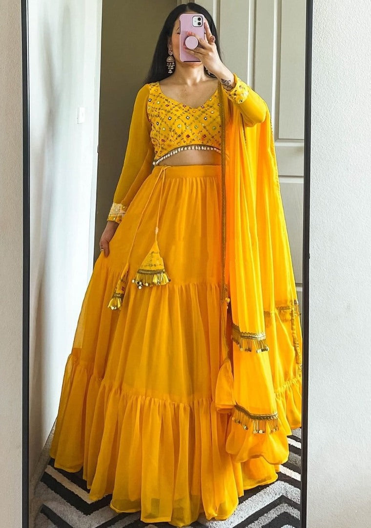 Yellow georgette ruffle lehenga choli for haldi ceremony