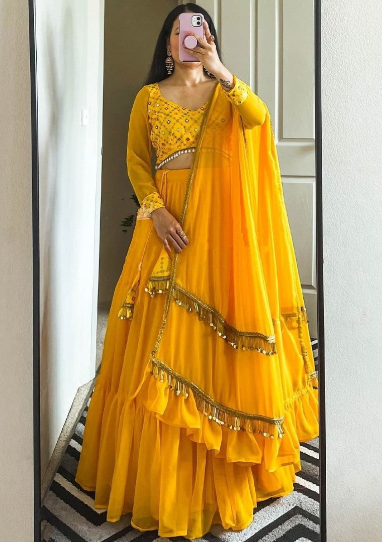 Yellow georgette ruffle lehenga choli for haldi ceremony