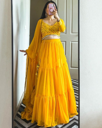 Yellow georgette ruffle lehenga choli for haldi ceremony