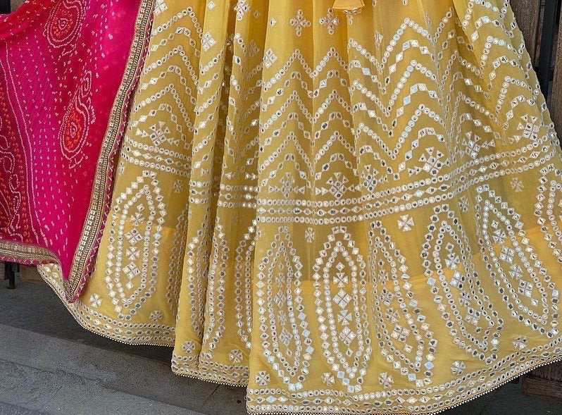 Yellow georgette thread paper mirror work lehenga choli for ceremony function