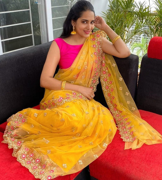 Yellow net embroidered festive saree