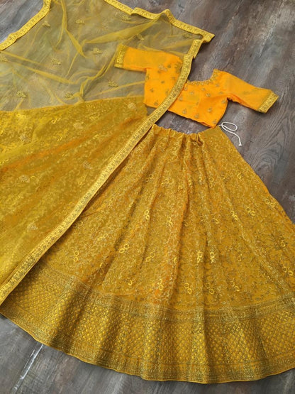 Yellow net glitter zari embroidery work lehenga choli