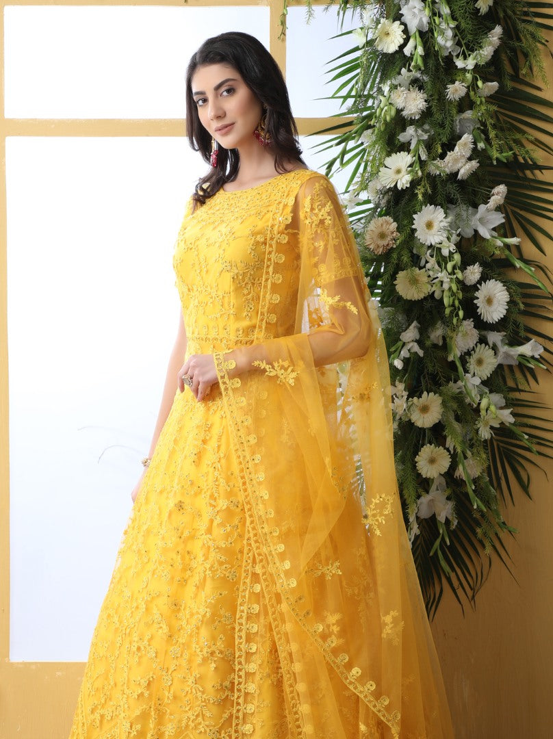Yellow net heavy embroidered wedding long anarkali gown