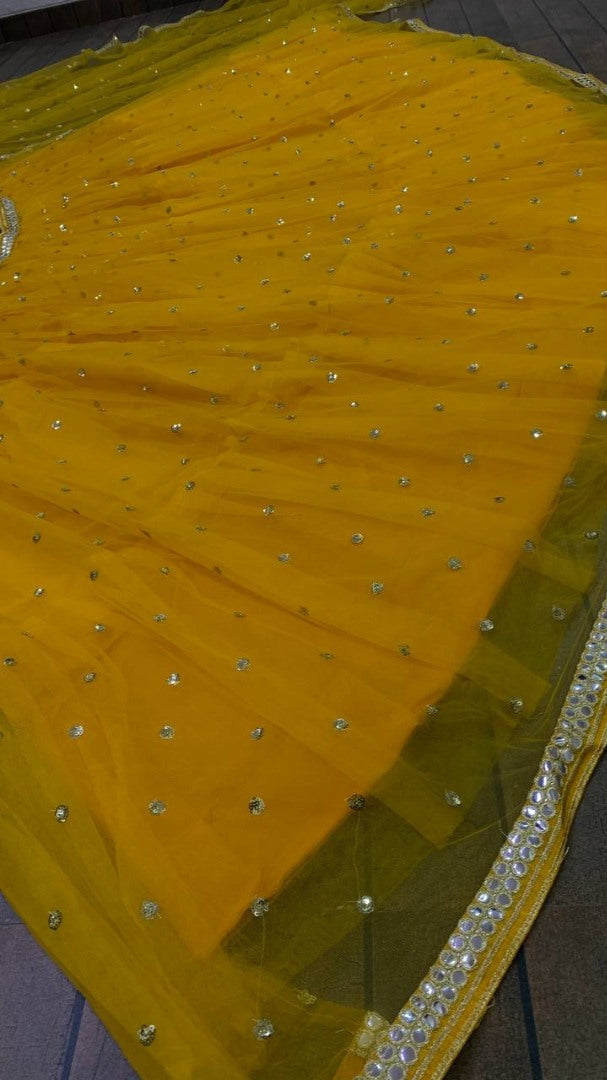 Yellow net sequence embroidery work ruffle lehenga choli for ceremony