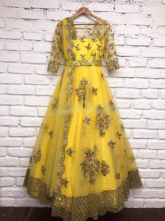 Yellow net sequence worked wedding gown with dupatta